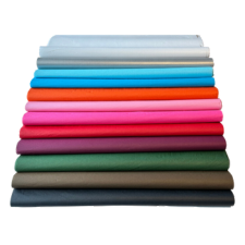 Image shows sheets of colourful tissue paper and then stacked on each other, showing a spectrum of colour. Tissue paper, available from Macfarlane Packaging. 