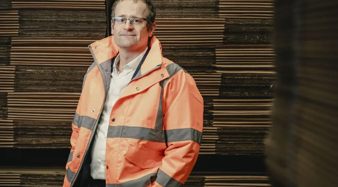 Image shows David Patton, Macfarlane Packaging's head of sustainability, wearing an orange high visibility jacket